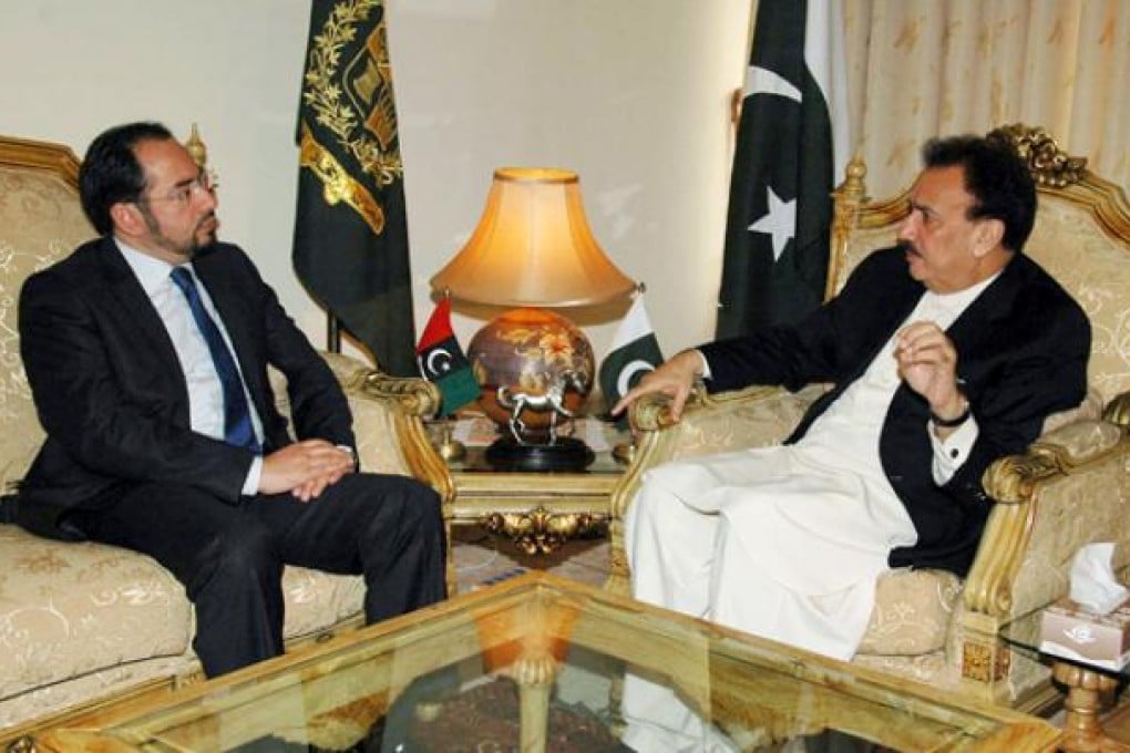 Pakistan's Interior Minister Rehman Malik (right) meets with Salahuddin Rabbani, head of Afghanistan High Peace Council, in Islamabad on Wednesday. Photo: AP