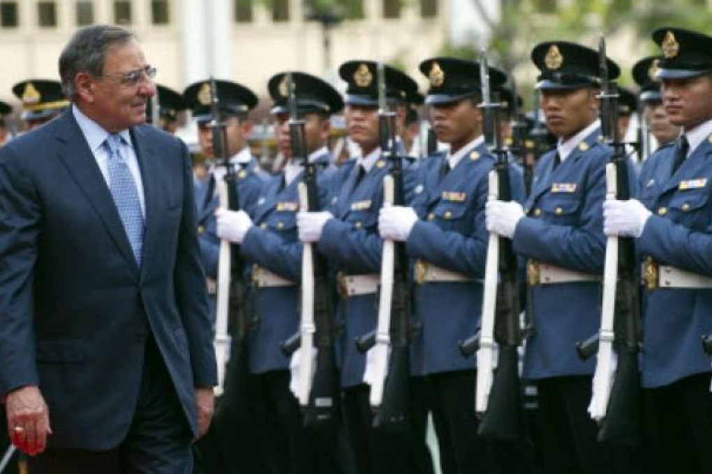 US Defence Secretary Leon Panetta (left) reviews an honour guard during a ceremony prior to a meeting Thai counterpart Sukampol Suwannathat in Bangkok on Friday. Photo: AP