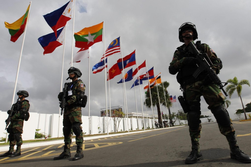 Cambodian paramilitary officers stand guard at Phnom Penh International Airport as the country hosts the 21st Asean summit.Photo: EPA