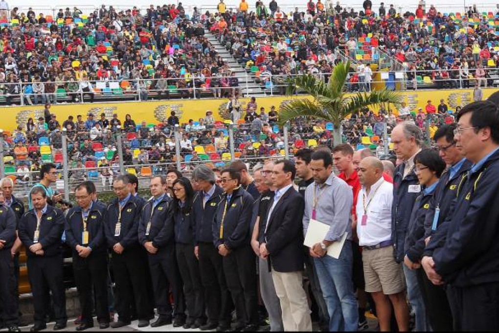 A minute's silence is observed in Macau for the deaths of Hong Kong's Phillip Yau Wing-choi and Luis Carreira of Portugal. Photo: Nora Tam