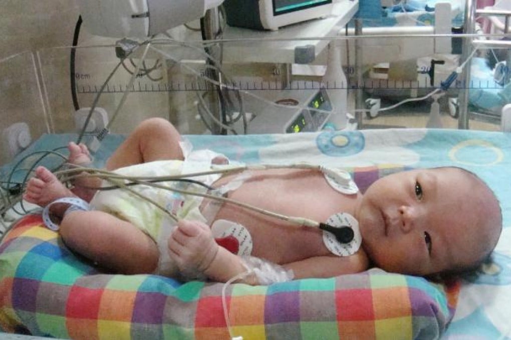 Baby Lin Xia at a Guizhou hospital. Photo: Lo Wei