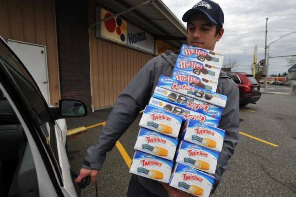 A man hoards Twinkies after Hostess said it was closing. Photo: MCT