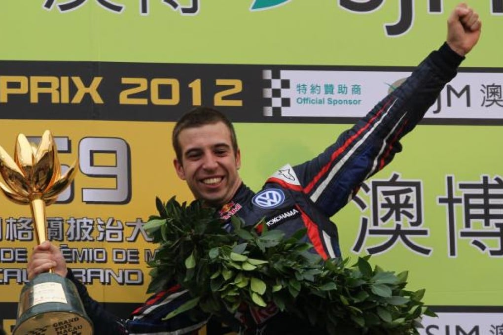 Antonio da Costa celebrates with his trophy. Photo: Nora Tam