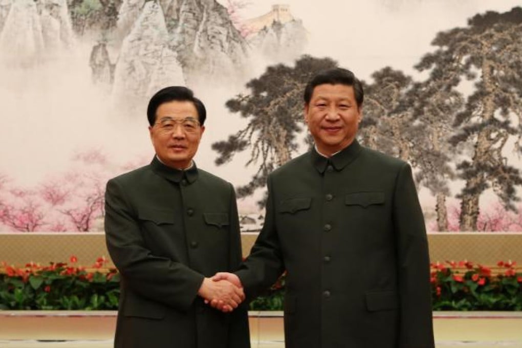 Hu Jintao and Xi Jinping at Friday's military commission meeting. Photo: Xinhua