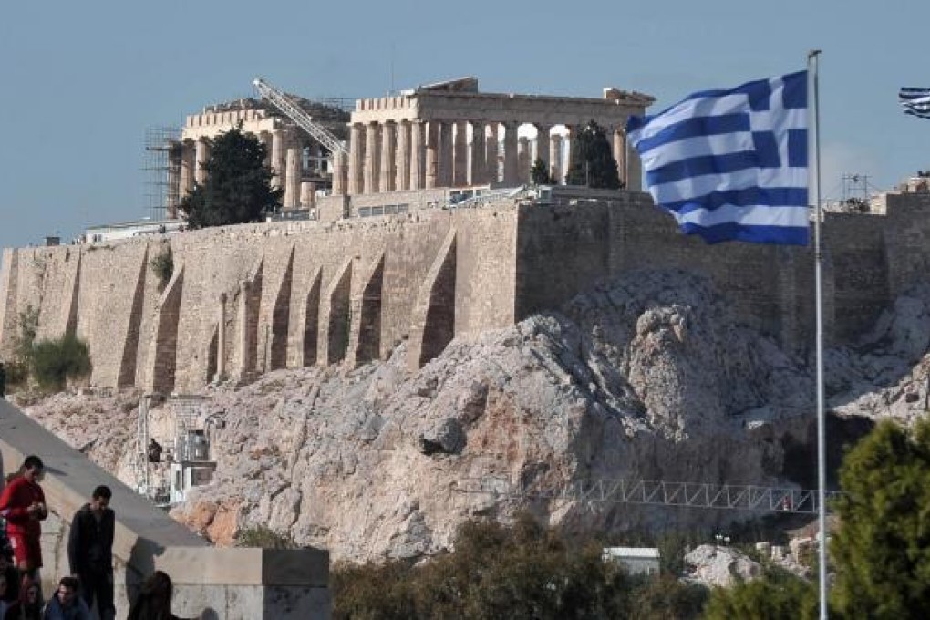 Greece is likely to need another aid package after 2014 despite having undergone the biggest sovereign restructuring in history. Photo: AFP