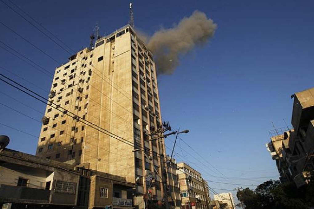 An Israeli air strike targets Hamas' television channel Al-Aqsa in Gaza. Photo: AFP