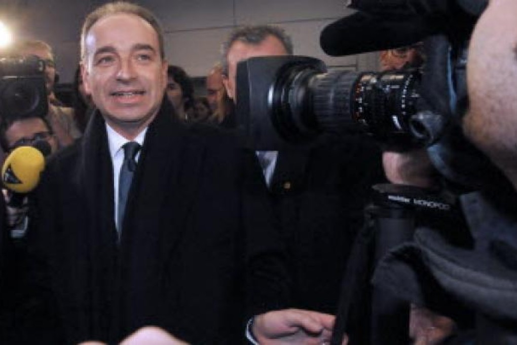 France's opposition UMP party's general secretary Jean-Francois Cope arrives at the party's headquarters to wait for the election results. Photo: AFP
