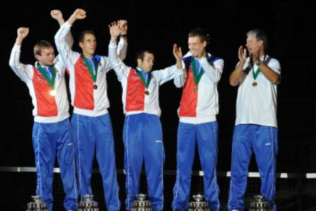 Members of Czech Republic's Davis Cup celebrate their victory over Spain at the end of the International Tennis Federation Davis Cup final match between Czech Republic and Spain on Sunday in Prague. Photo