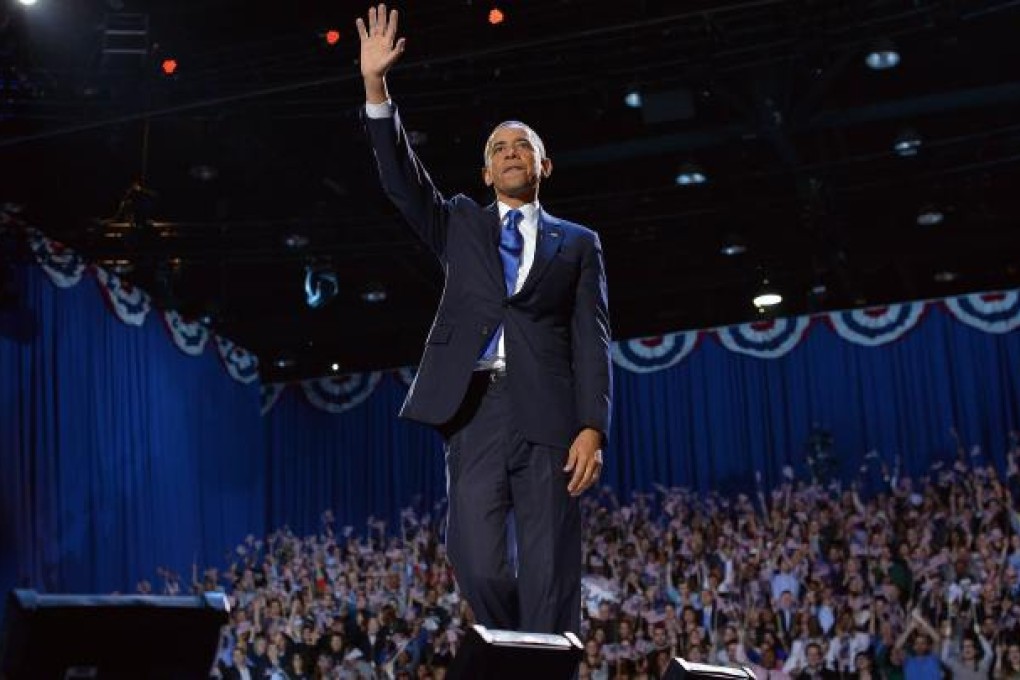 US President Barack Obama waves at supporters following his victory speech on election night November 6, 2012 in Chicago, Illinois. Photo: AFP