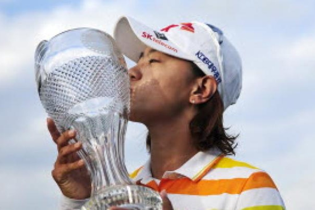 Na Yeon Choi, of South Korea, kisses her trophy after winning the LPGA Titleholders golf tournament, on Sunday, in Naples, Florida. Photo: AP