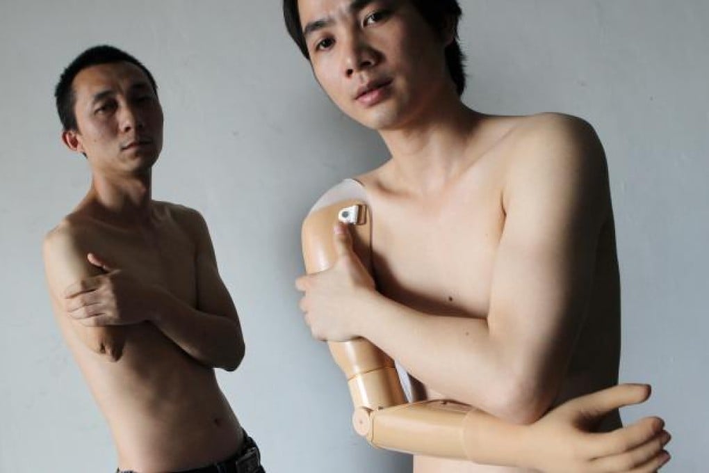 Liang Jun (left), a printing worker, and Li Jiangping, an air-conditioner mechanic, were injured on the job in Foshan. Photo: K.Y. Cheng