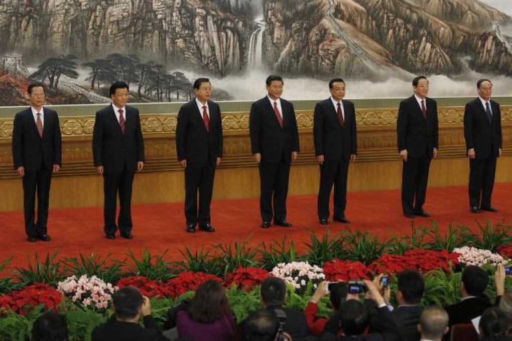 New members of the Politburo Standing Committee, from left, Zhang Gaoli, Liu Yunshan, Zhang Dejiang, Xi Jinping, Li Keqiang, Yu Zhengsheng and Wang Qishan. Photo: AP