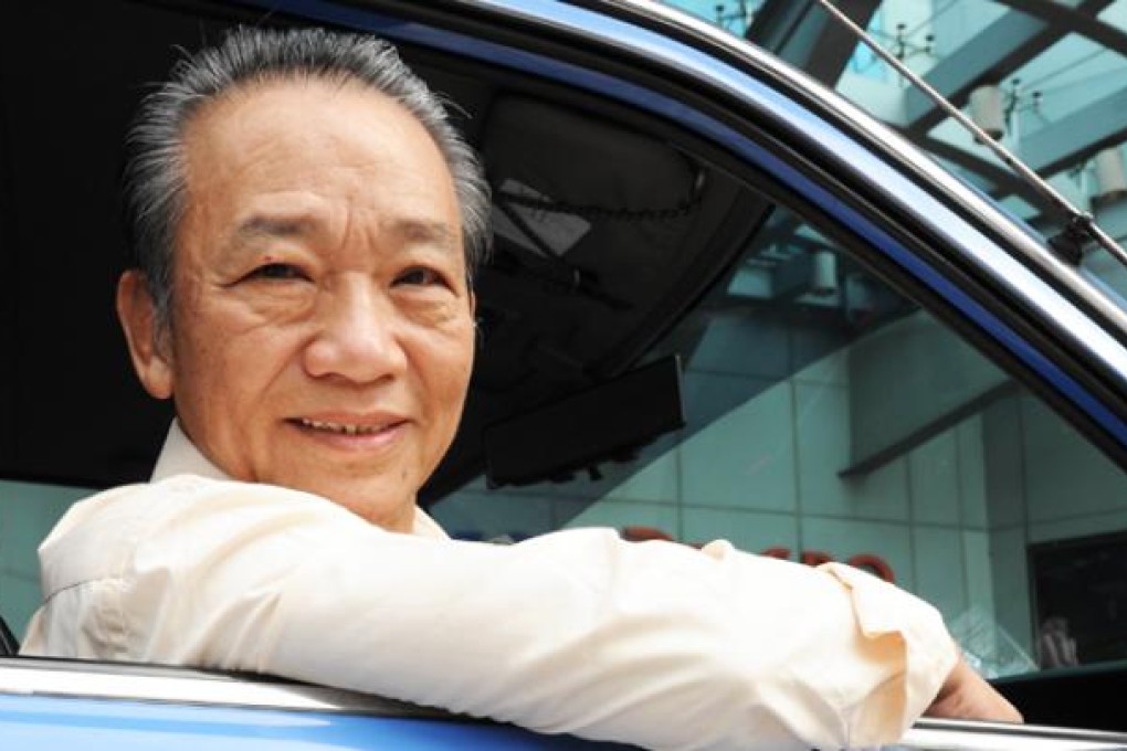 Singapore cab driver Sia Ka Tian sits in his taxi. Photo: AFP