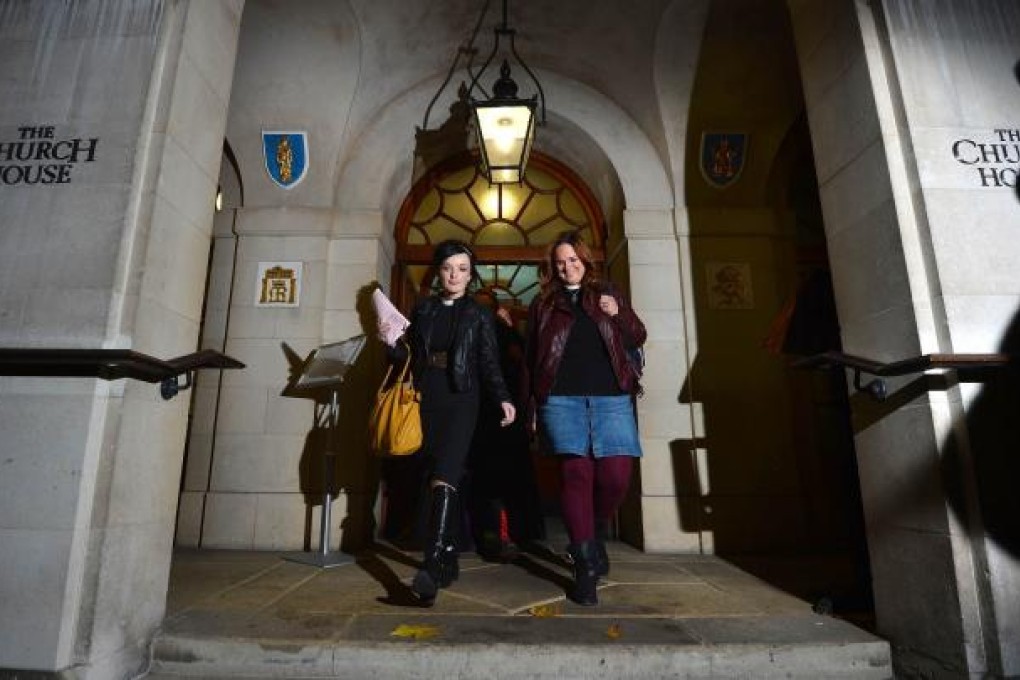 Female members of the clergy leave after the Church of England's draft legislation approving women bishops failed to pass during the England General Synod. Photo: AFP