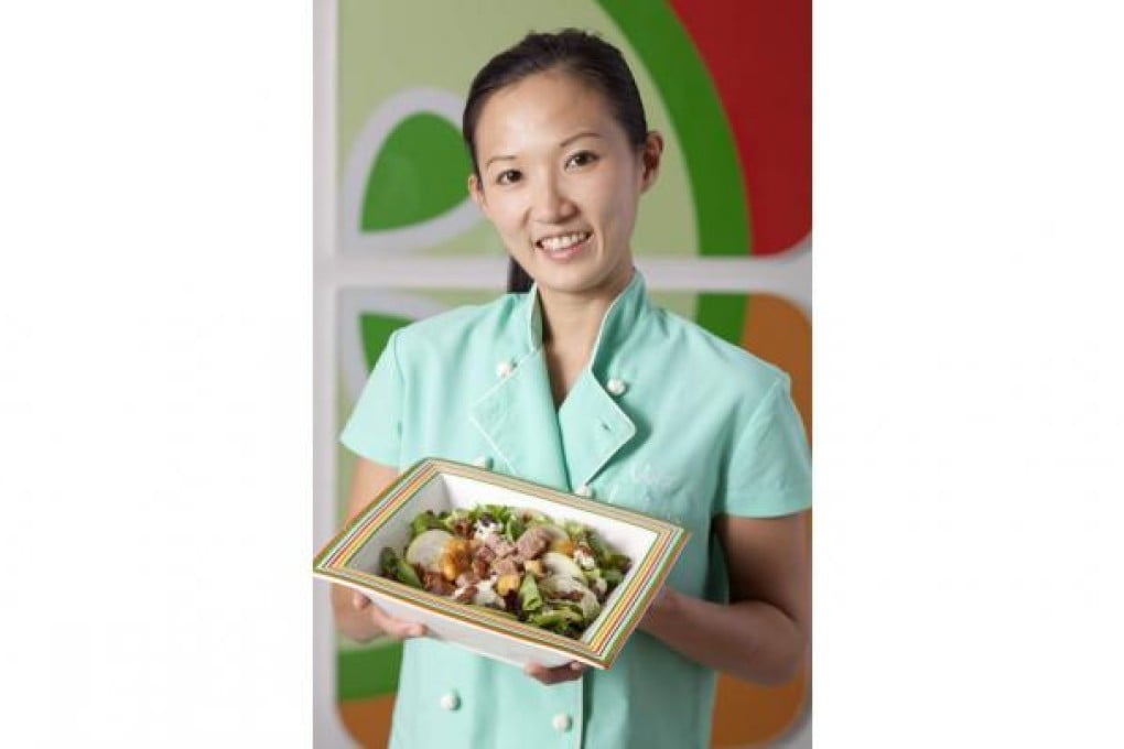 Chef Vivian Herijanto shows off her creation. Photo: SCMP
