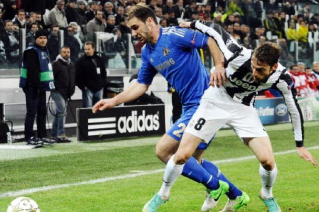 Claudio Marchisio (right) of Juventus and Branislav Ivanovic (left) of Chelsea in action during the UEFA Champions League Group E soccer match Juventus FC vs Chelsea FC in Turin, Italy on Wednesday. Photo: AFP
