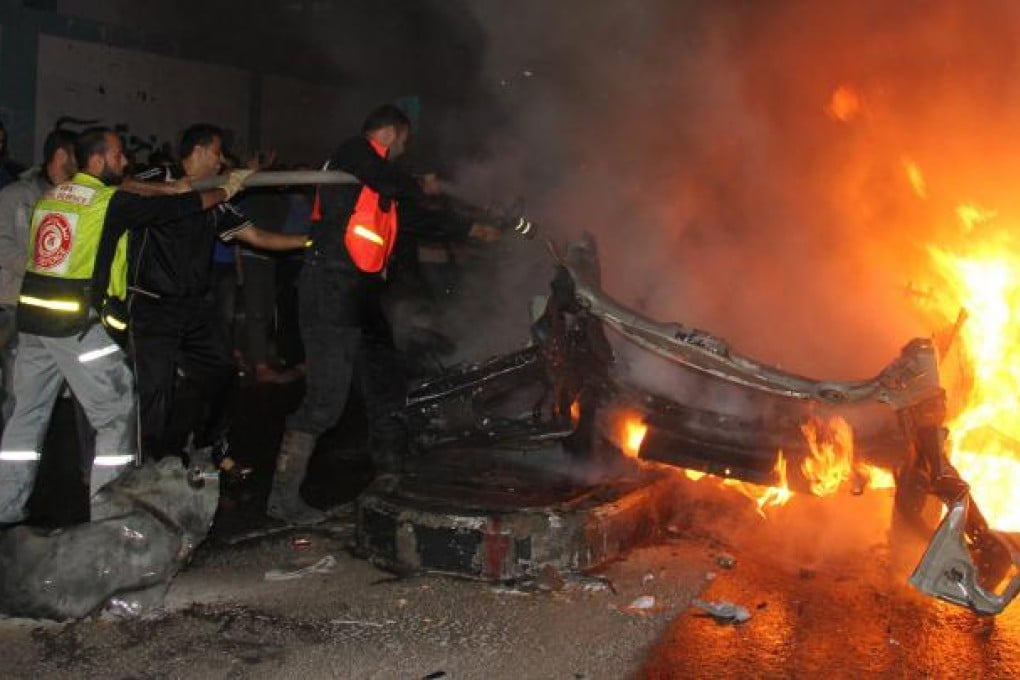 The wreck of the al-Aqsa TV car hit by Israel, killing two men.