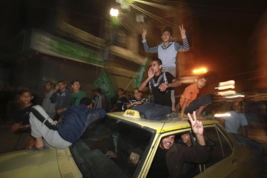 Palestinians in Gaza City celebrate what they say is a victory over Israel after an eight-day conflict. Photo: Reuters