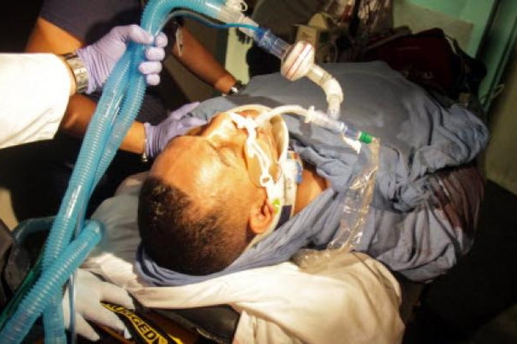 Former world boxing champion Hector "Macho" Camacho is taken by paramedics inside a medical center in San Juan, Puerto Rico. Photo: AP