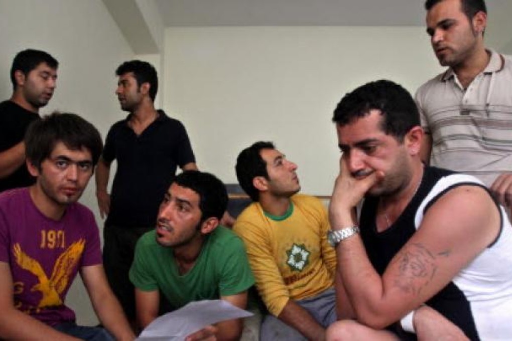 Australia wants to discourage people like these would-be migrants from Afghanistan and Iran, who were rescued when a boat carrying about 250 people began to sink off Java.  Photo: EPA