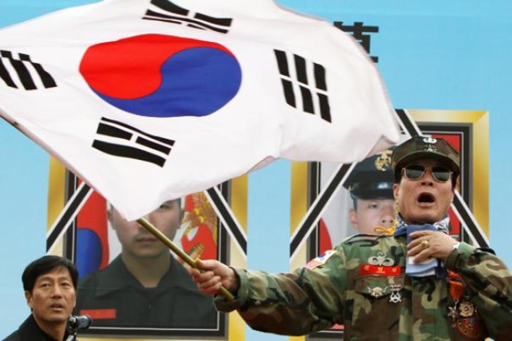 South Korean veterans and conservative civic groups attend a memorial service for victims of the artillery attack on Yeonpyeong island in Seoul on Thursday. Photo: Xinhua