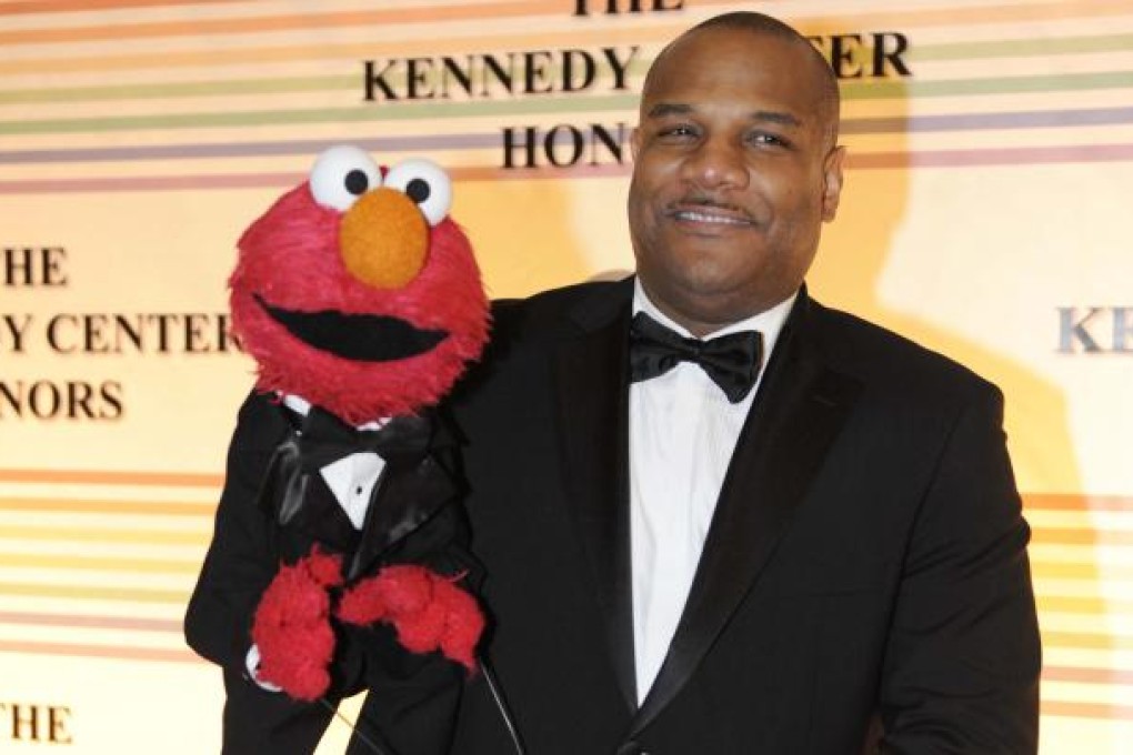 "Sesame Street" character Elmo and puppeteer Kevin Clash. Photo: AP