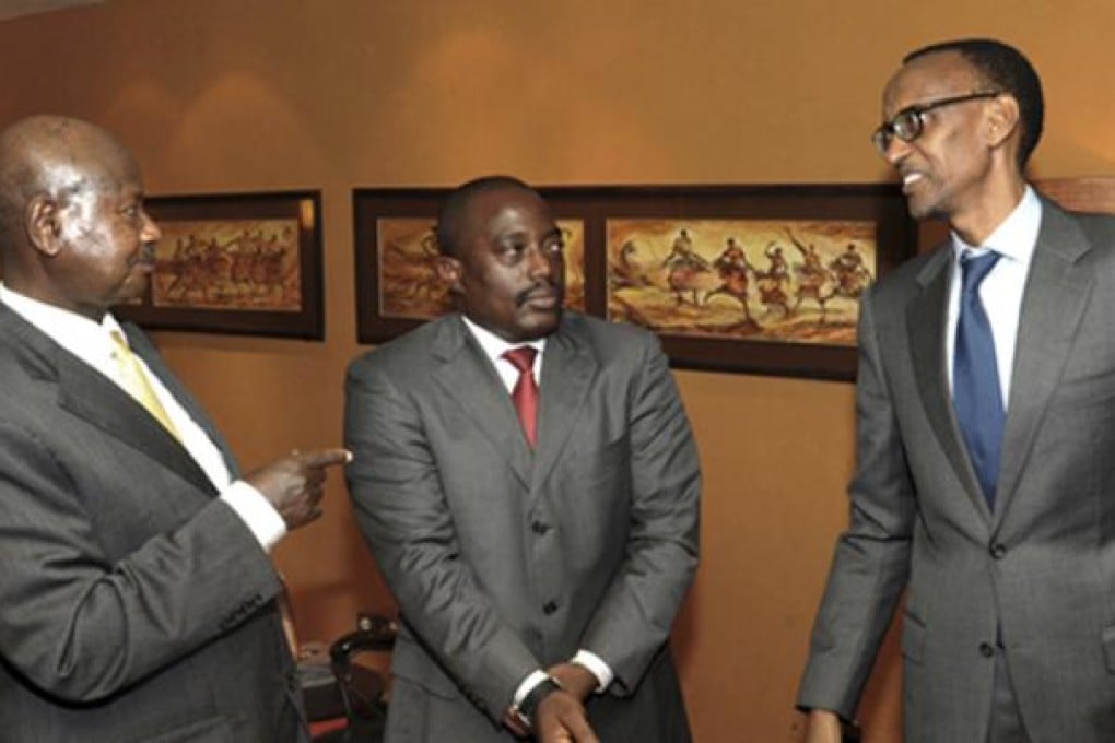 Uganda's President Yoweri Museveni (left) talks with his counterparts Paul Kagame of Rwanda (right) and Joseph Kabila of Congo during a meeting in Kampala, Uganda, on Wednesday. Photo: AP
