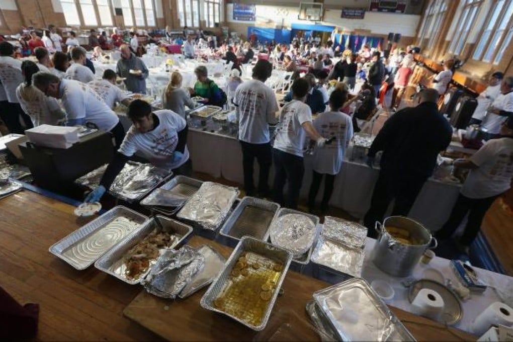 Free Thanksgiving dinners at a parish in Rockaway. Photo: AFP