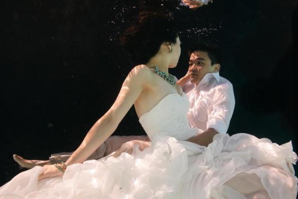 Theresa Tse and Anthony Wong are avid divers who took photos underwater before their big day.