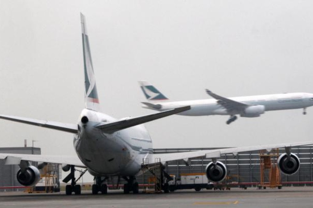Cathay Pacific Airways is battling rising operating costs as well as lower cargo and passenger yields. Photo: David Wong