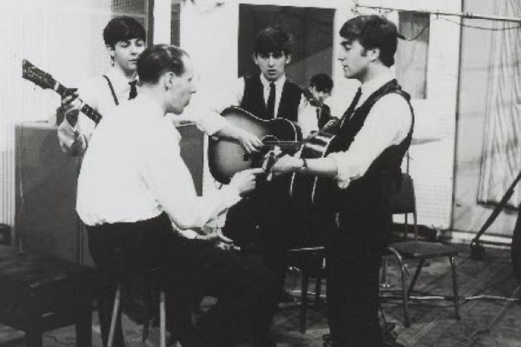 The Beatles, with producer George Martin, in a recording session for EMI, who picked up the group when Decca did not want them. Photo: Abbey Road Studios/EMI