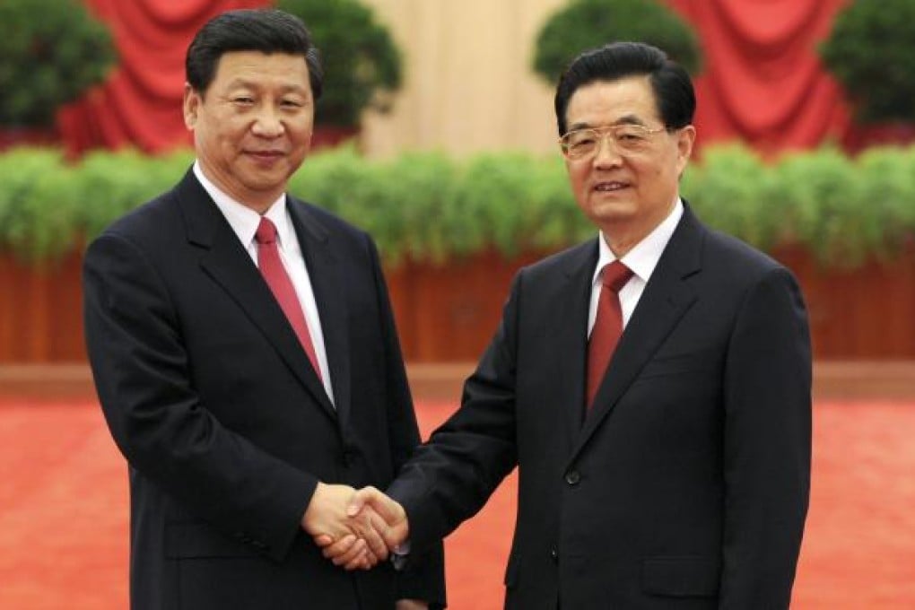 Hu Jintao, right, shakes hands with Xi Jinping as they meet with delegates to the 18th Communist Party Congress in Beijing. Photo: AP