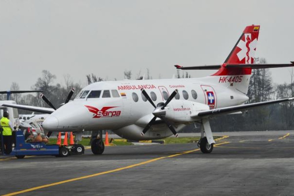 An air ambulance transporting the four Chinese oil workers \released from their Farc captors lands at the airport in Bogota. Photo: AFP