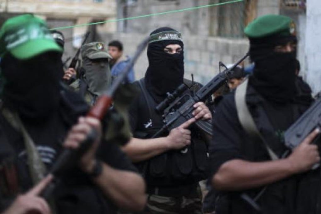 Masked and armed members of Hamas in Gaza. Photo: EPA
