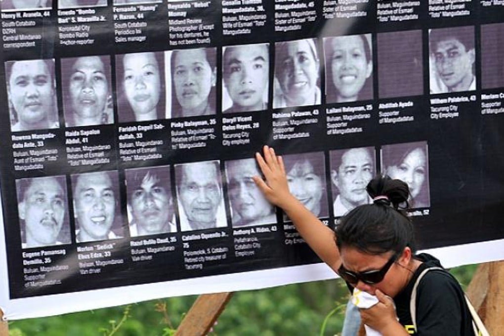 A relative of one of the 58 victims slain in the 2009 massacre grieves at a memorial service in Ampatuan, Maguindanao province. Photo: AFP