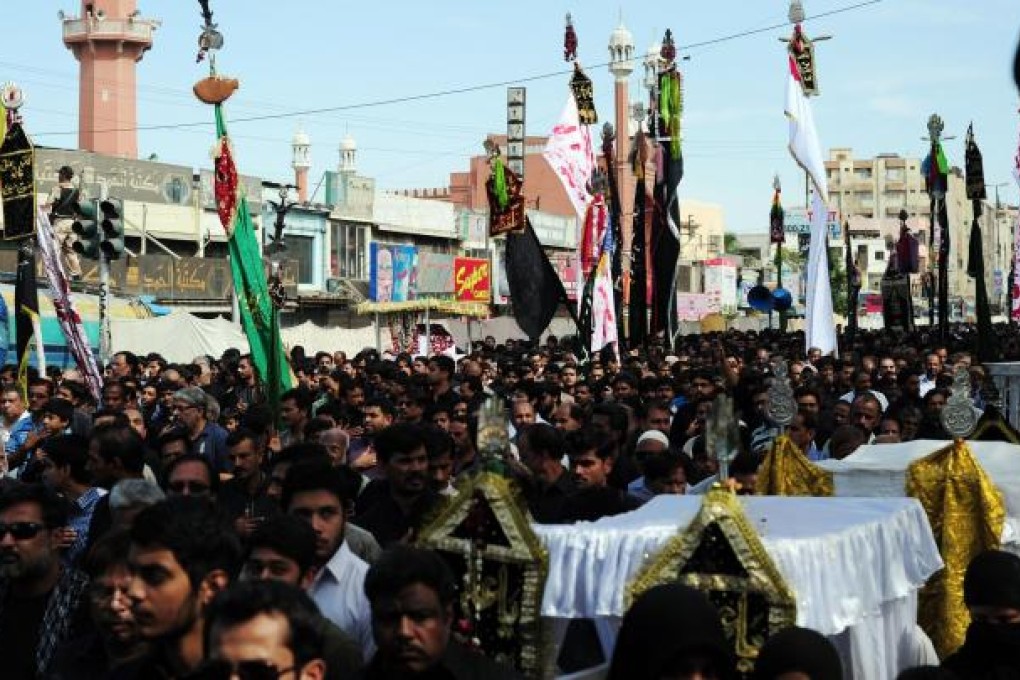 Shiites march in a procession in Karachi yesterday. Photo: AFP