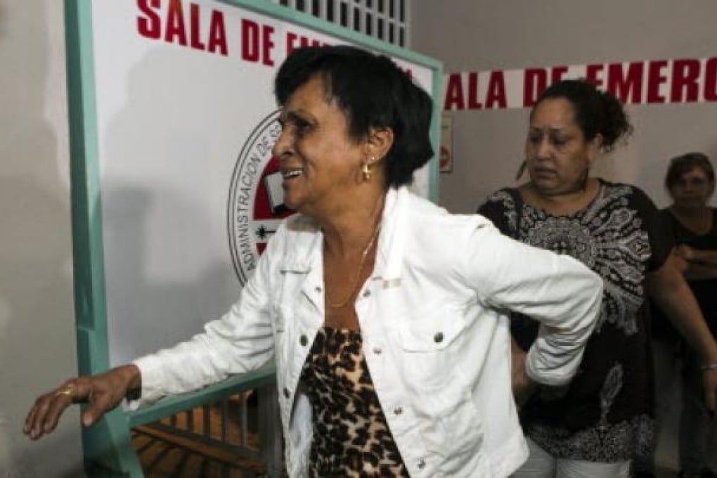 Maria Matias, left, mother of former world boxing champion Hector " Macho" Camacho, walks to attend a news conference outside Centro Medico trauma center in San Juan, Puerto Rico. Photo: AP