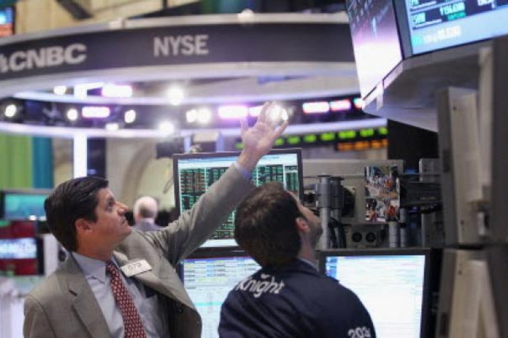 Traders work on the floor of the New York Stock Exchange. Photo: AFP