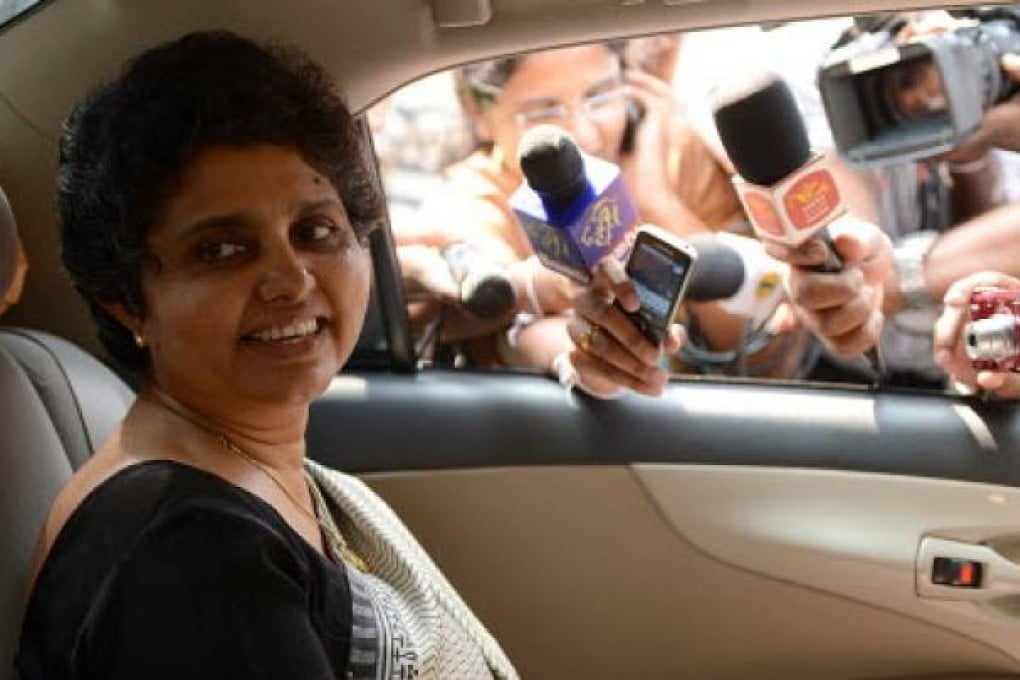 Sri Lanka’s Chief Justice Shirani Bandaranayake smiles as she leaves the parliamentary complex in Colombo on November 23, 2012. Photo: AFP