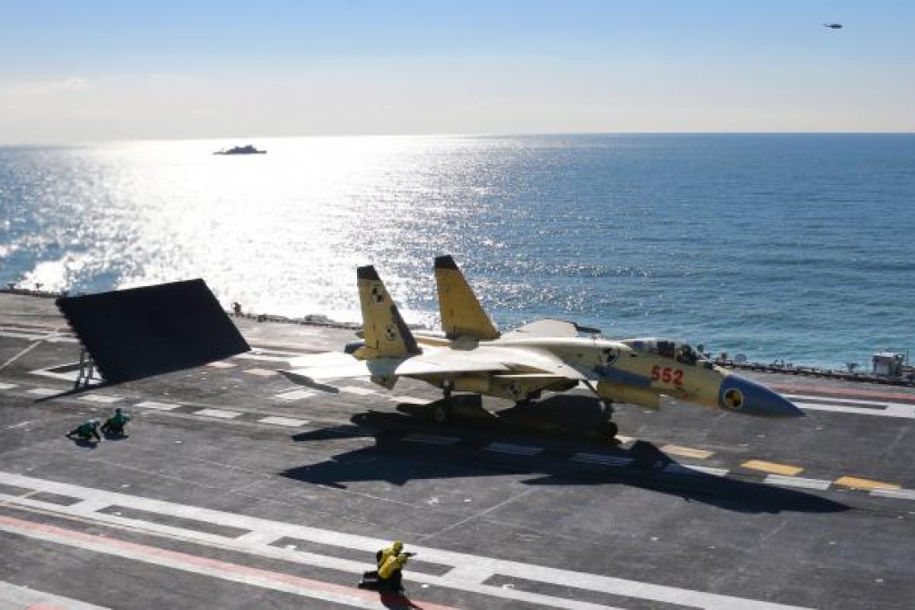 A carrier-borne J-15 fighter jet ready to take off from China's first aircraft carrier, the Liaoning. Photo: Xinhua