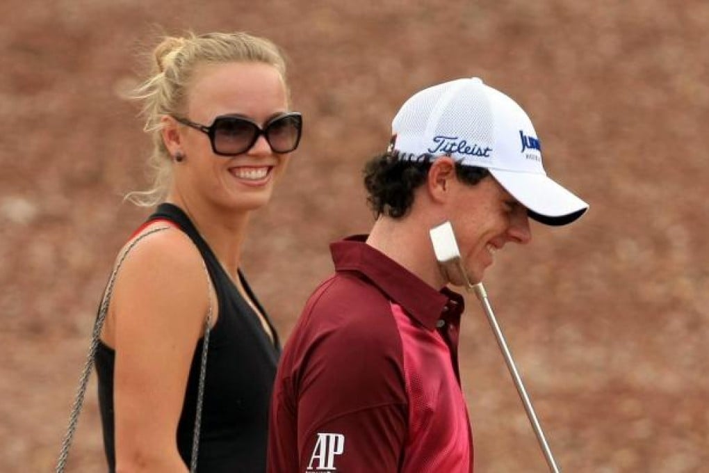 Caroline Wozniacki chats with her boyfriend Rory McIlroy in Dubai yesterday. Photo: EPA
