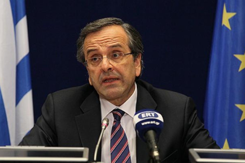 Greece Prime Minister Antonis Samaras attends a news conference after the second day of a European summit at the EU headquarters on Friday. Photo: EPA