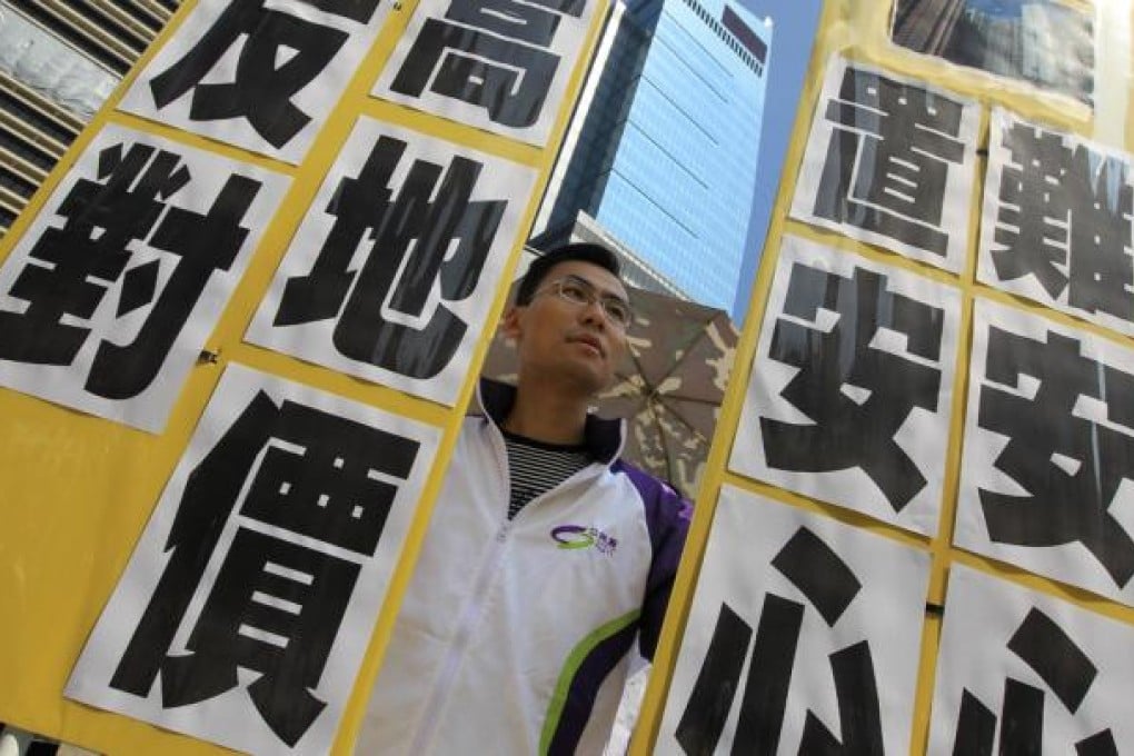 Caring HK march to oppose the government's 'My Home Purchase Scheme' as they think it is not helpful in assisting sandwich class to buy flats. Photo: Edward Wong