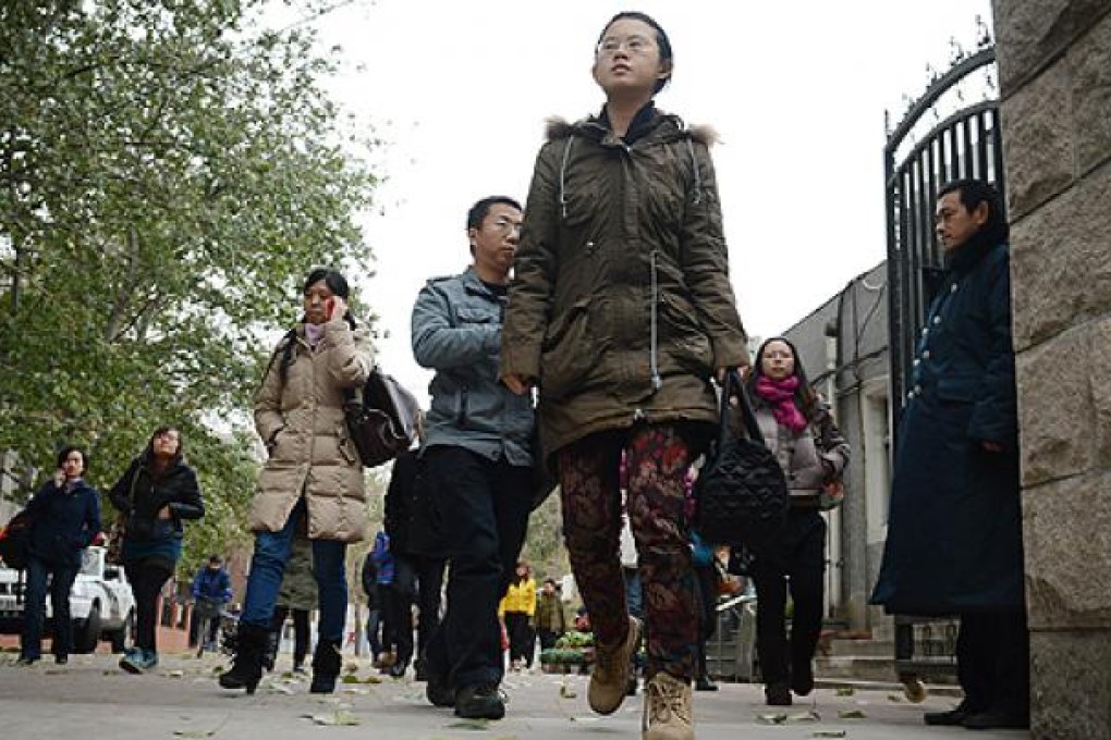 Students leave a middle school to take a lunch break during the annual civil service examinations in Beijing. Photo: AFP
