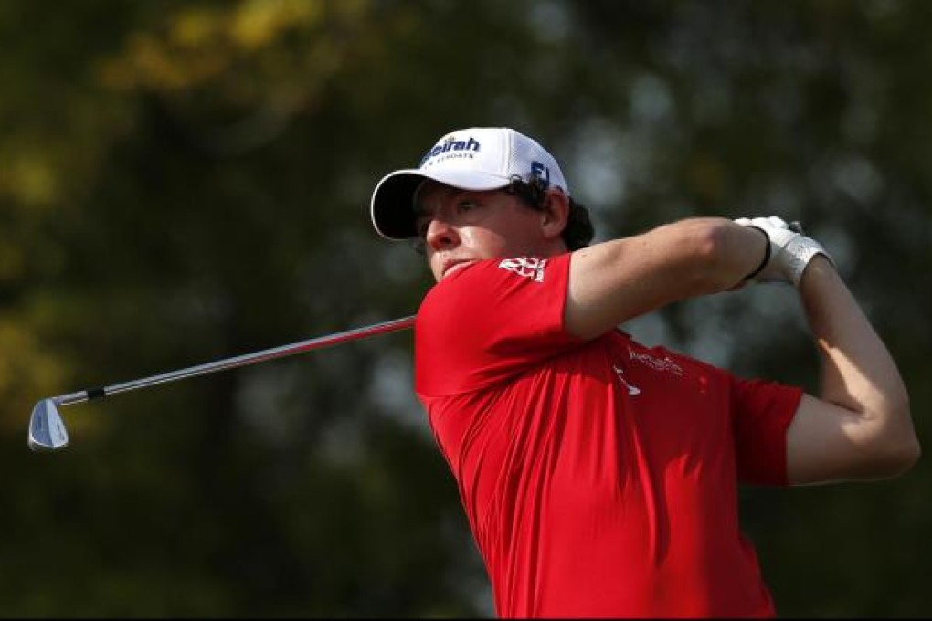 Rory McIlroy of Northern Ireland watches his shot from the 11th tee on his way to victory in Dubai yesterday. Photo: Reuters