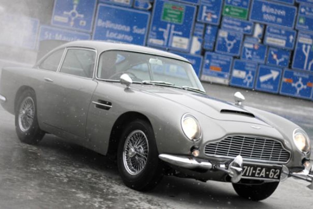 The 1964 Aston Martin DB5, made famous in the James Bond movies <i>Goldfinger</i> and <i>Thunderball</i>, is displayed after restoration in Luzern. Photo: Reuters