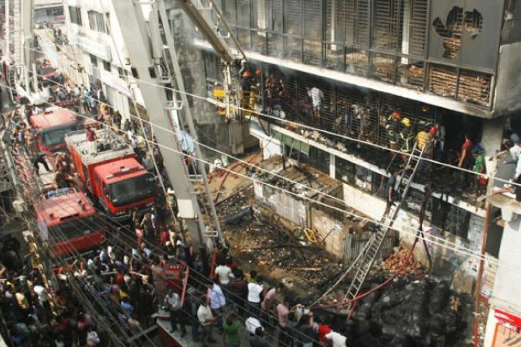 Bangladesh firefighters quell a garment factory blaze on Monday as the country mourns the death of 110 workers in a weekend blaze at another apparel plant, the export industry's worst-ever accident. Photo: AFP