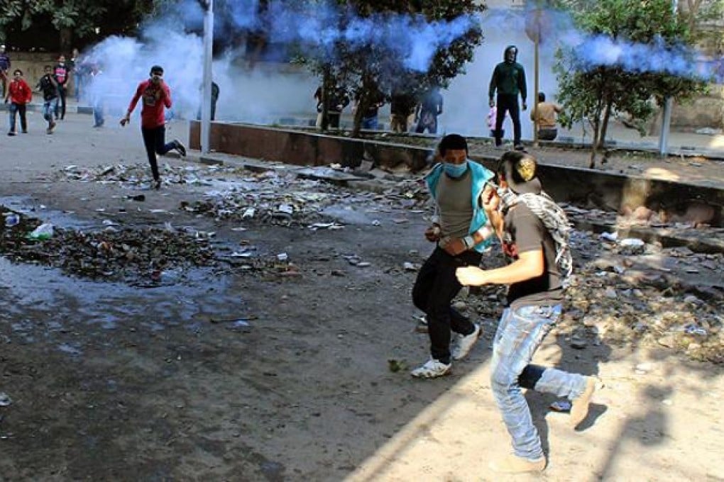 Egyptian protesters clash with police in Tahrir Square in Cairo. Photo: EPA