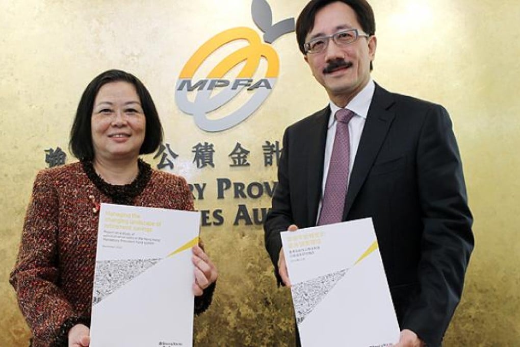 Wu Hung-yuk and John Poon, of the Mandatory Provident Fund Schemes Authority outline cost-cutting measures for MPF providers. Photo: Edward Wong