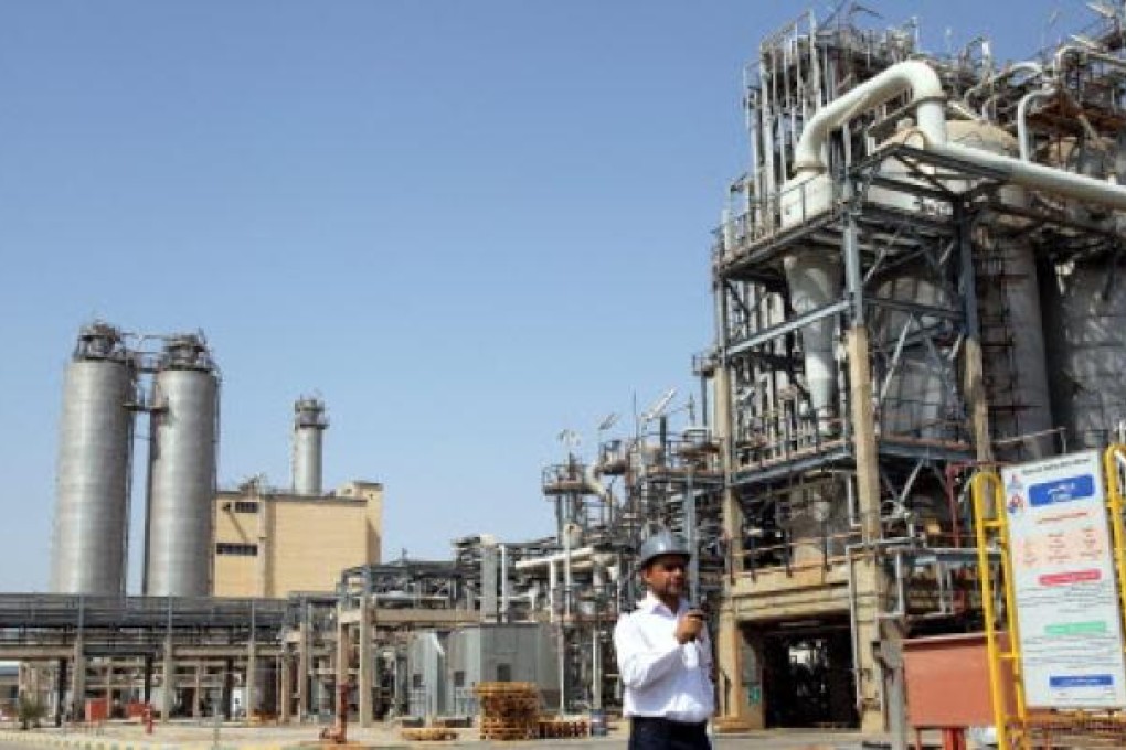 An Iranian security guard walking in front of the Mahshahr petrochemical complex in Khuzestan province south western Iran on September 28, 2011. Photo: EPA
